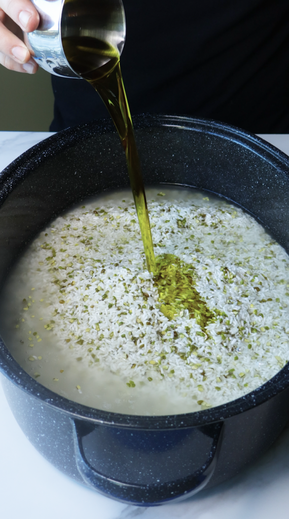 1. Add rinsed rice and mung beans to a large Dutch oven, then add water, beef broth, tomato sauce, oil, chickpeas, seasonings, and cilantro. 